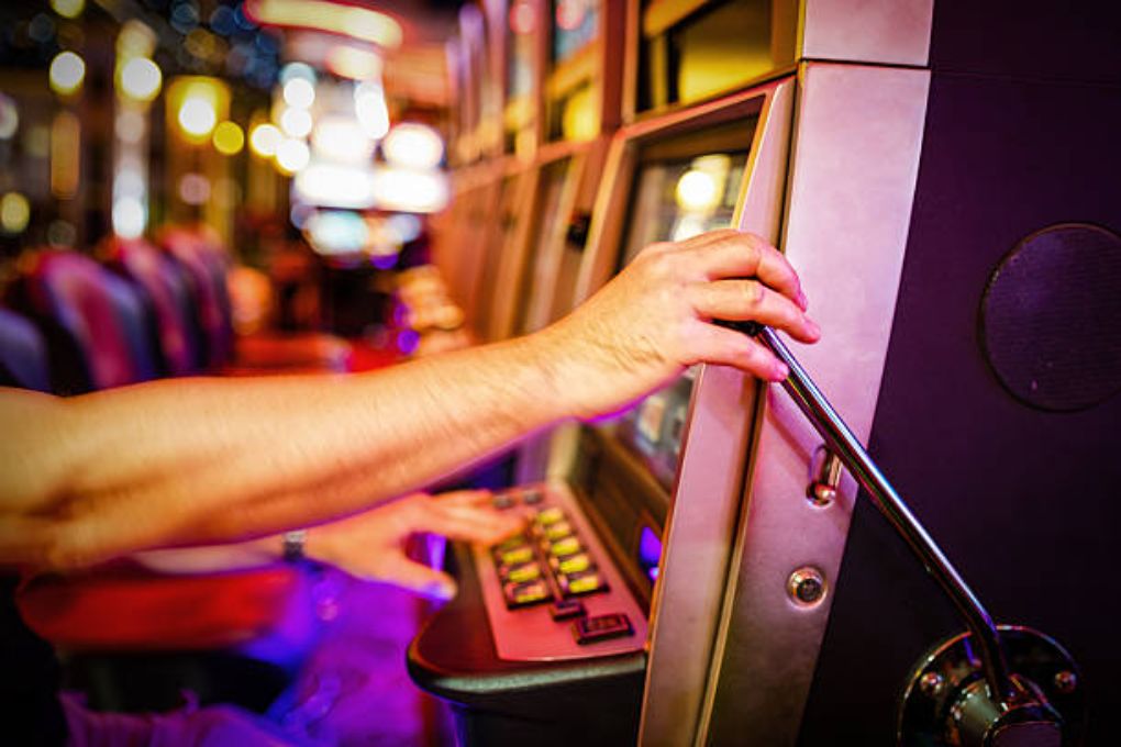 Slot machine hold by the player